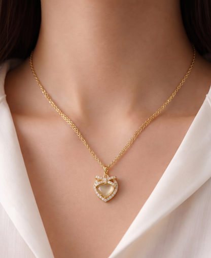 gilded bow shimmering heart pendant necklace