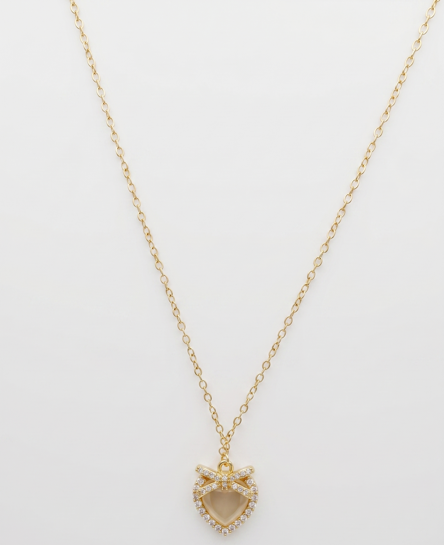 gilded bow shimmering heart pendant necklace