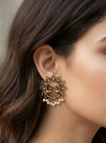 the royal peacock studs